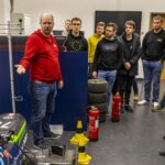 Group of students and a trainer at the training for electrical system officers