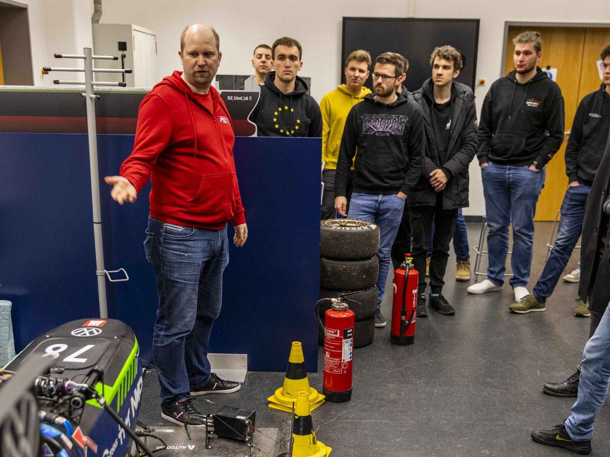 Group of students and a trainer at the training for electrical system officers